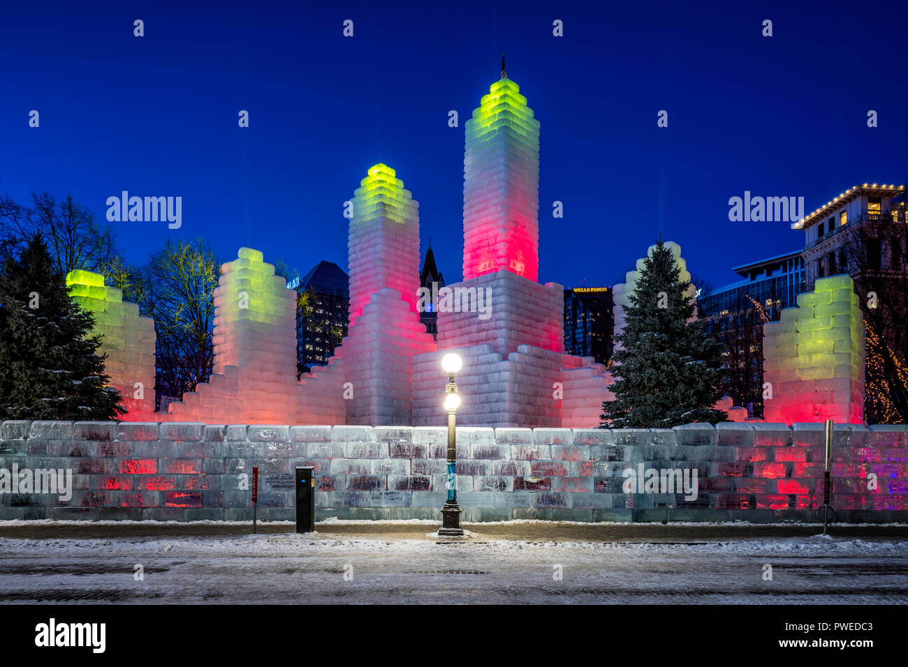 2018 Saint Paul Winter Carnival Ice Palace with red and yellow lighting. The ice palace was built in Rice Park downtown St. Paul, Minnesota. Stock Photo