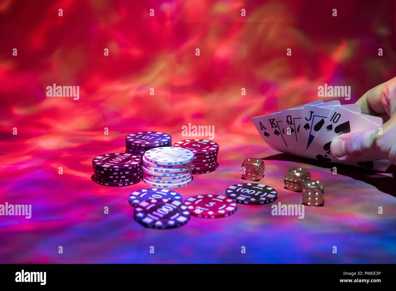 Casino abstract photo. Poker game on red background. Theme of gambling  Stock Photo - Alamy
