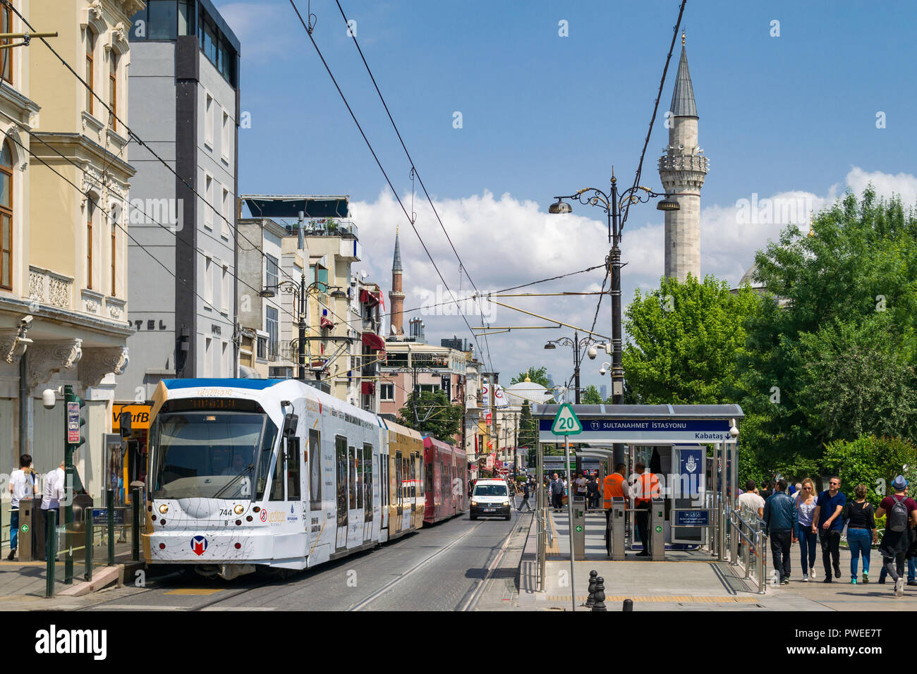 Sultanahmet T1 tram station with tram at platform as people walk past, Istanbul, Turkey Stock Photo