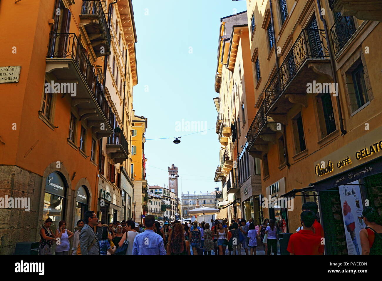 A view to Piazza delle Erbe-the central square in the old town of Verona from busy Via Cappello,Italy Stock Photo