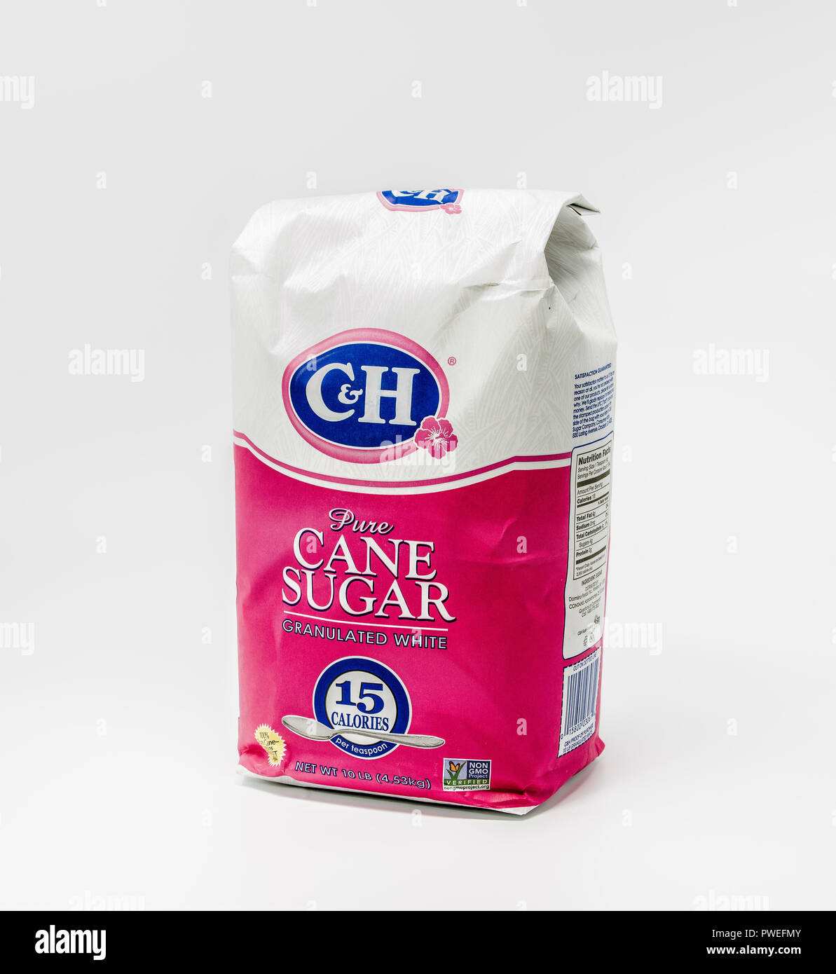 Portland, OR / USA - October 11 2018: C&H  Pure white granulated cane sugar in a big paper bag, isolated on light background. Produced by Domino foods Stock Photo