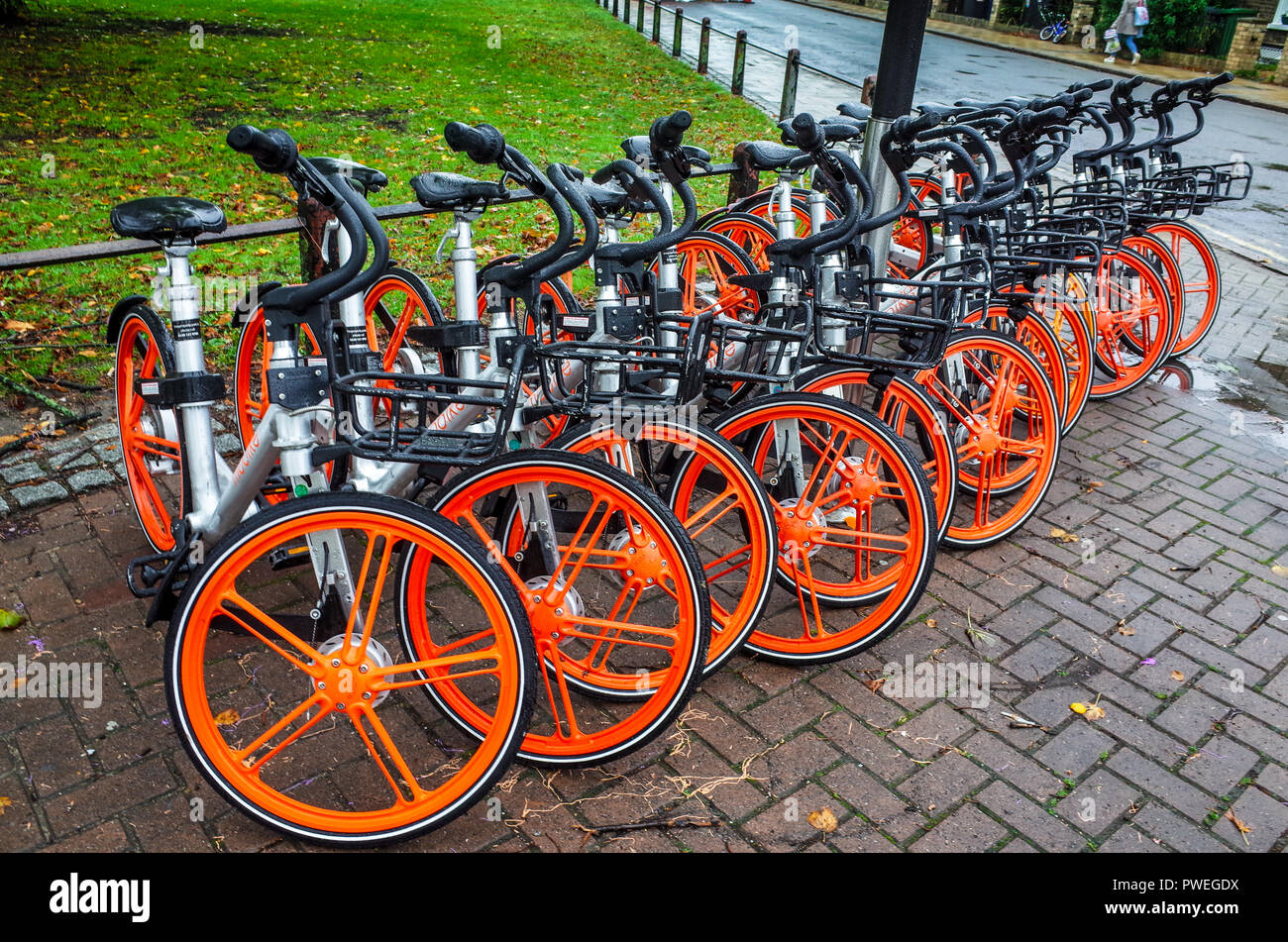 Mobike dockless hire bikes in Cambridge UK - Mobike is a Chinese bike hire company rolling out across the UK Stock Photo