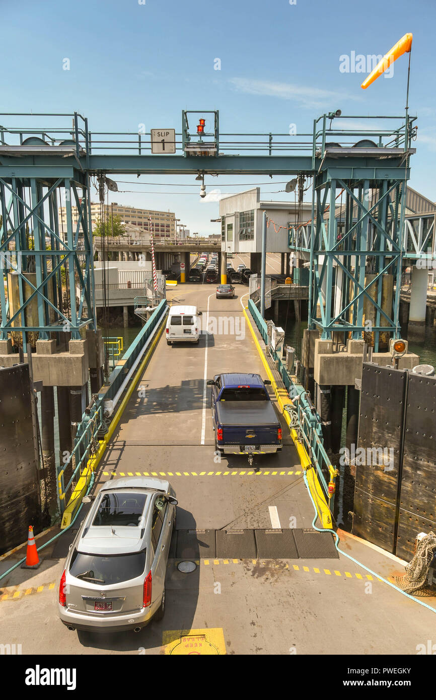 BREMERTON, WASHINGTON STATE, USA - JUNE 2018: Vehicles driving up the ramp off a ferry which has arrived at Bremerton from Seattle. Stock Photo