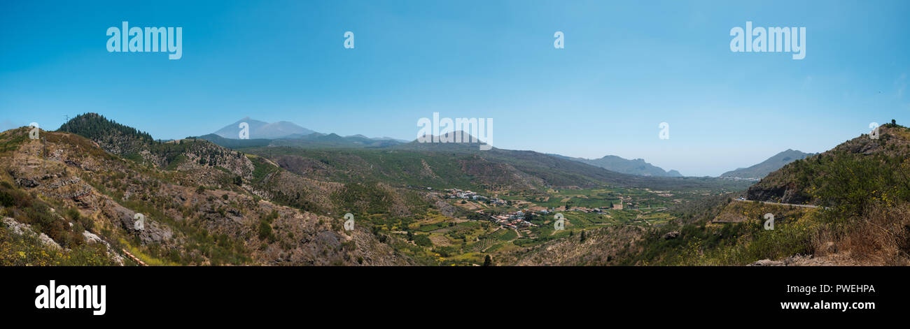landscape panorama , green valley with mountain Teide background and clear blue sky, Tenerife - Stock Photo