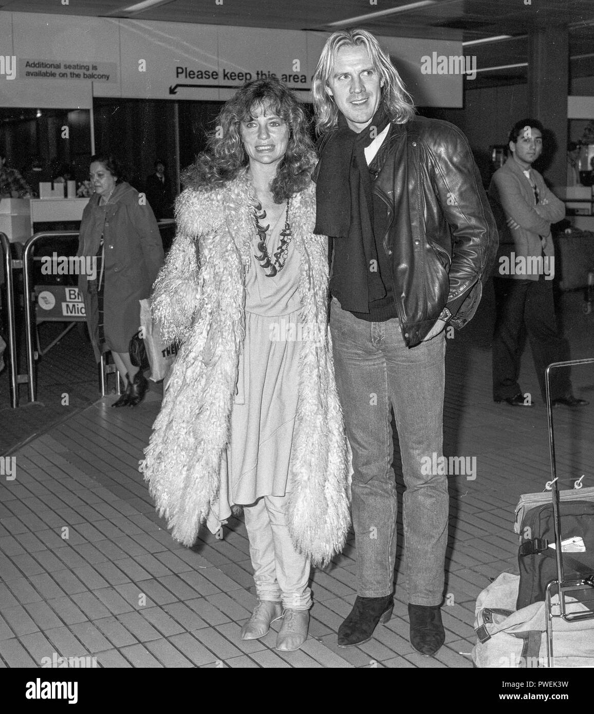 Jacqueline Bisset with husband Alexander Godunov leaving Heathrow 1984. Stock Photo