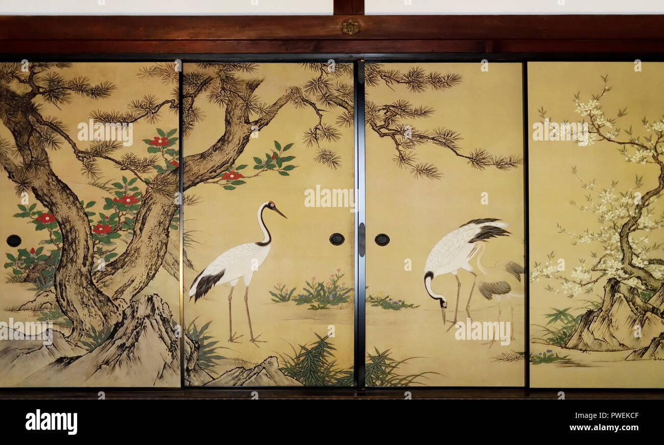 License and prints at MaximImages.com - Traditional Japanese temple room interior with cranes painted on golden sliding doors, Kin-busuma or fusuma Stock Photo