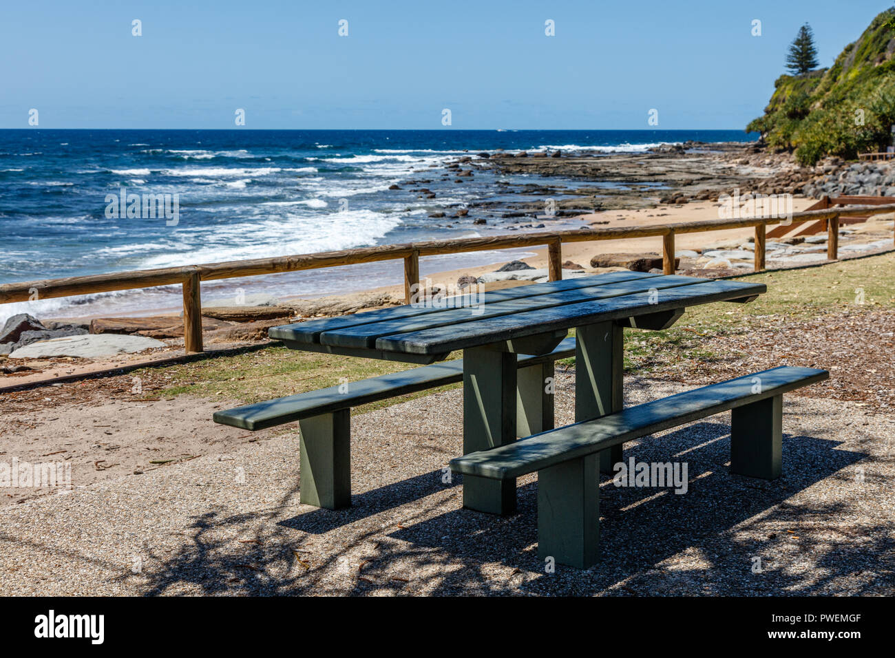 Public park wooden bench near the ocean at Moffat Beach, Sunshine Coast, Queensland, Australia Stock Photo