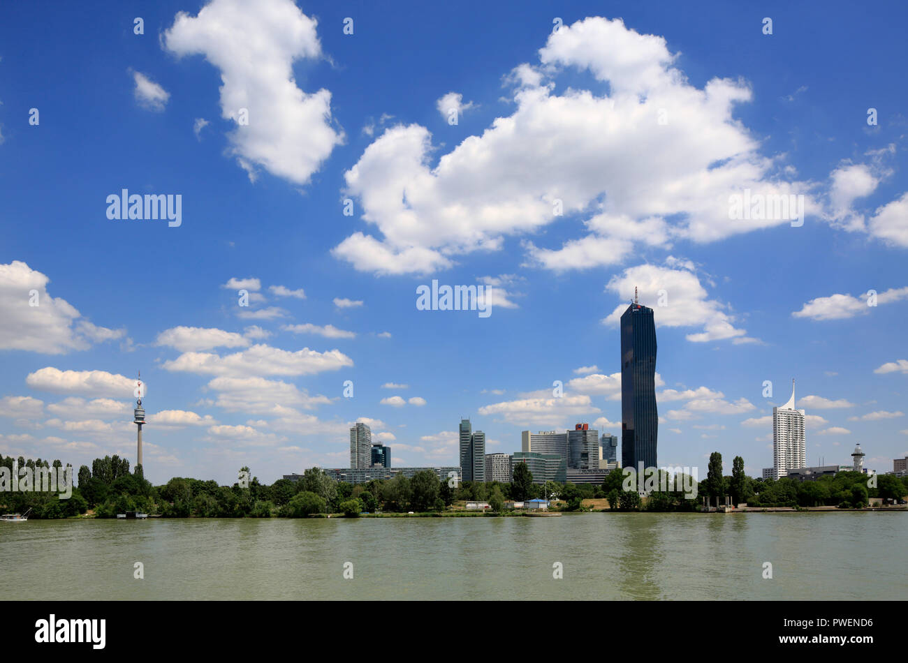 Austria, A-Vienna, Danube, Federal Capital, skyline of the Donau City, f.l.t.r. Danube Park with Donau Tower, Mischek Tower, residential tower, Saturn Tower, Commercial Tower, Ares Tower, Commercial Tower, UNO City with VIC Vienna International Centre and Austria Center Vienna, conference center, IZD Tower, Commercial Tower, DC Tower 1, Commercial Tower, skyscraper, highrise Neue Donau, apartment tower, river landscape, Danube landscape, Danube promenade, Danube bank, cumulus clouds Stock Photo