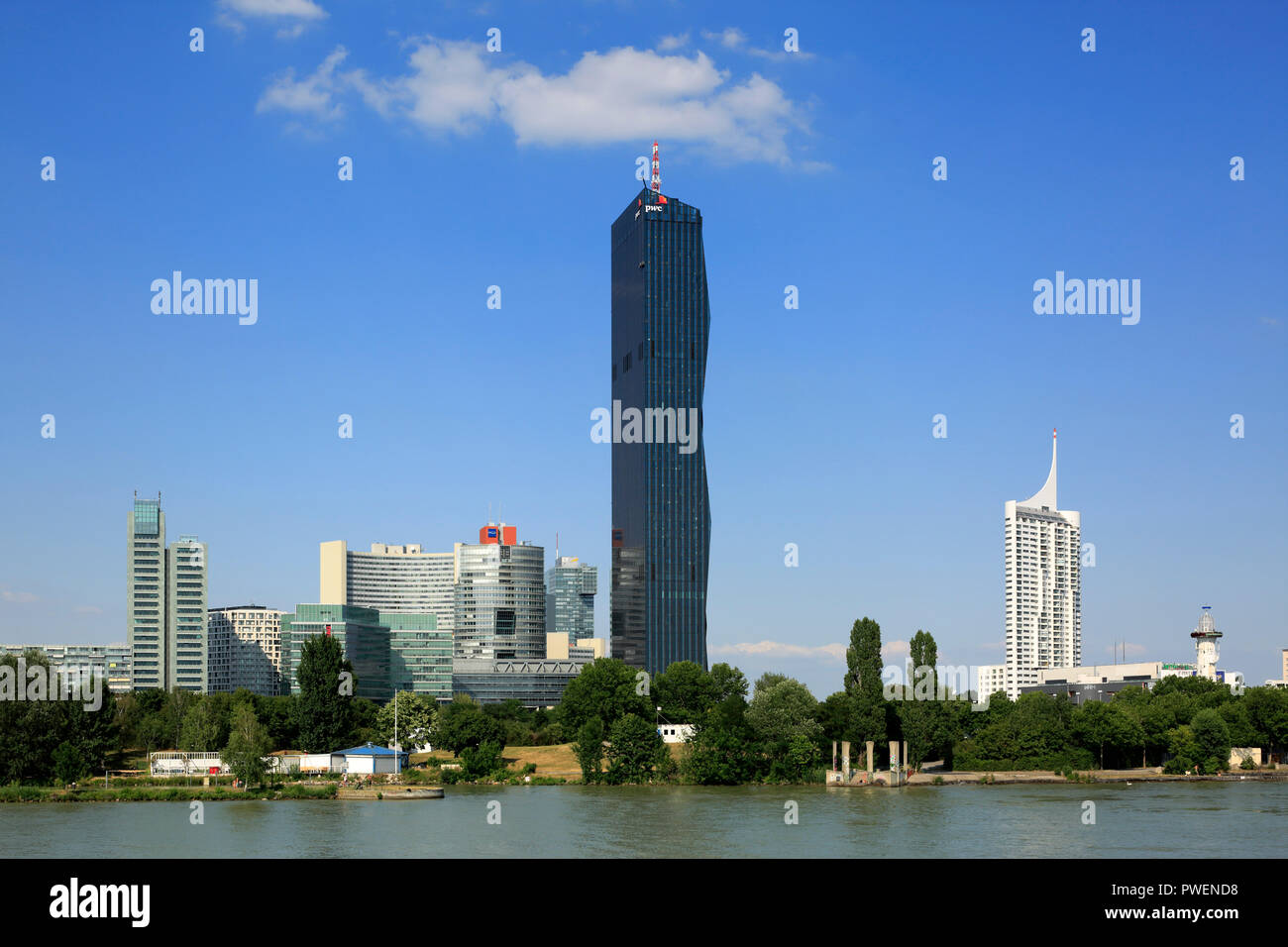 Austria, A-Vienna, Danube, Federal Capital, skyline of the Donau City, f.l.t.r. Ares Tower, Commercial Tower, UNO City with VIC Vienna International Centre and Austria Center Vienna, conference center, IZD Tower, Commercial Tower, DC Tower 1, Commercial Tower, skyscraper, highrise Neue Donau, apartment tower, river landscape, Danube landscape, Danube promenade, Danube bank, cumulus clouds Stock Photo