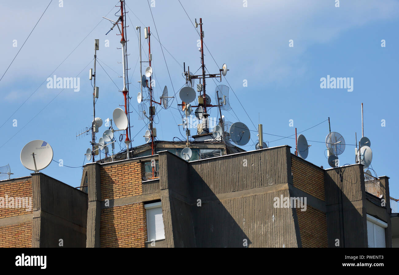 telecommunications, broadcasting, television, radio, high-rise residential  building, many receiving antennas on the rooftop of a multi-family house in  Novi Sad on the Danube, Serbia, Province Vojvodina, District South Backa,  European Capital of