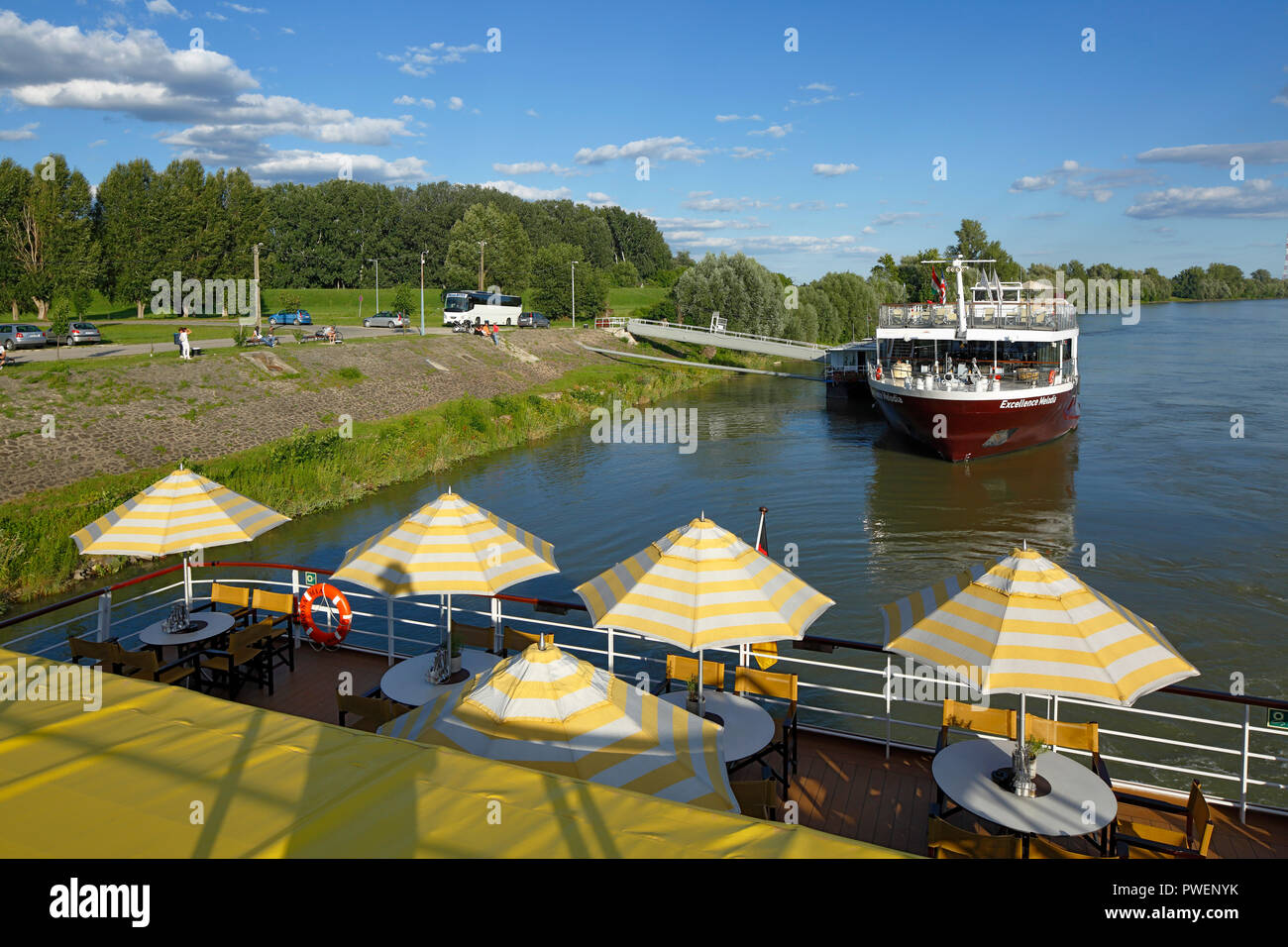 tourism, holiday, freetime, Danube river cruise, Danube navigation, cruisers Excellence Melodia and aROSA cruiser Mia, open afterdeck, dishes and sunshades, Danube landscape, river landscape, shipping pier in Kalocsa, Hungary, Southern Hungary, Pannonian Plain, Southern Great Hungarian Plain, Bacs-Kiskun County Stock Photo