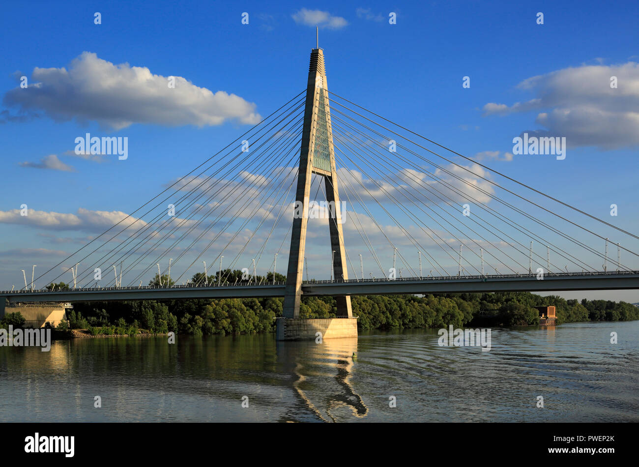 Hungary, Central Hungary, Budapest, Danube, Capital City, Megyeri Bridge, Northern M0 Danube bridge, highway bridge, cable-stayed bridge, Danube landscape, river landscape, evening, sunset, cumulus clouds, UNESCO World Heritage Site Stock Photo