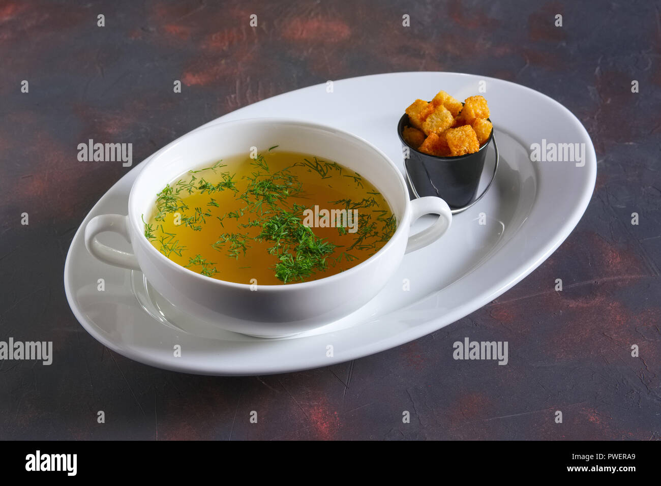 Plate of chicken bouillon Stock Photo Alamy