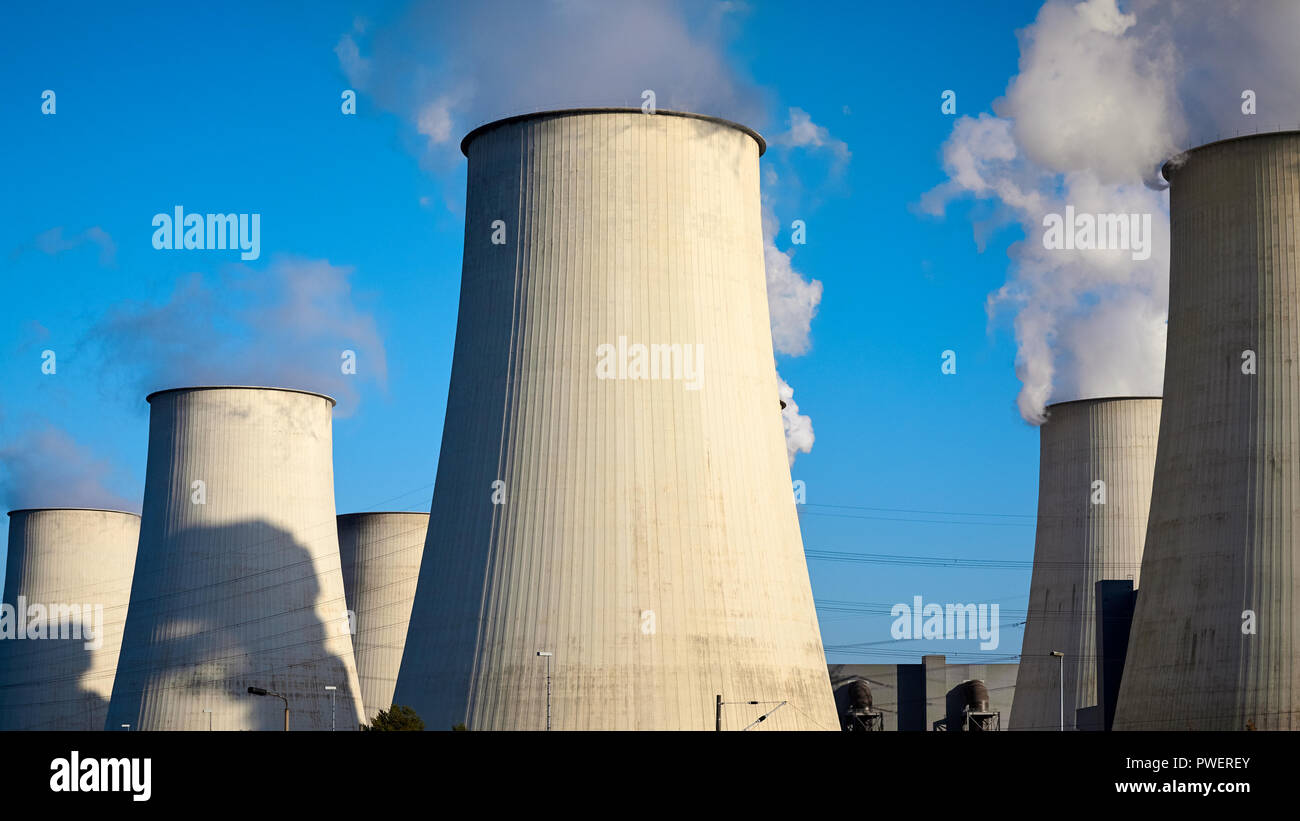 Smoking chimneys against the blue sky, environmental pollution concept. Stock Photo