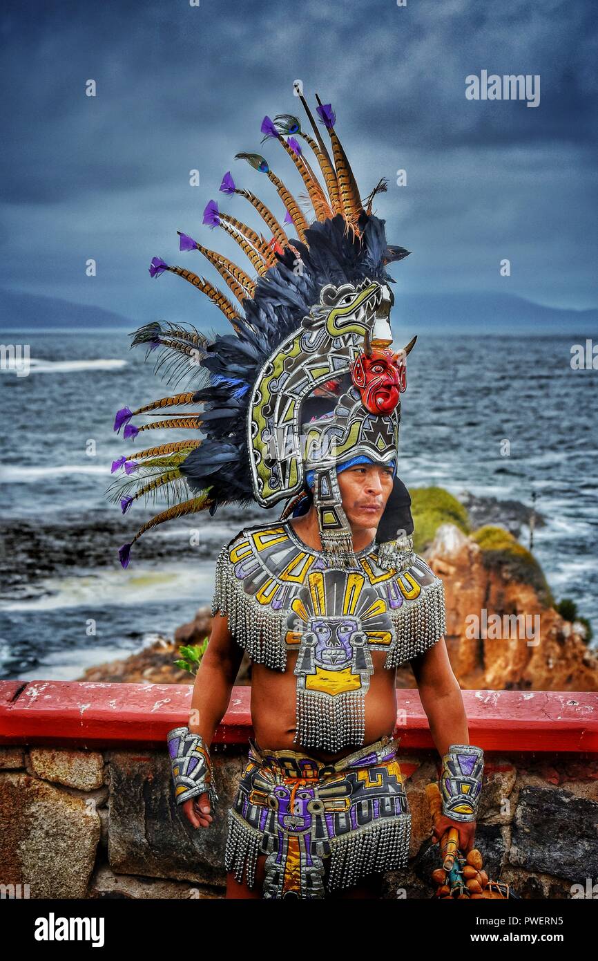 A Mexican man in an ancient Mayan/Aztec style costume in Ensenada, Mexico.  Photo taken on a cruise ship shore excursion to La Bufadora. Stock Photo