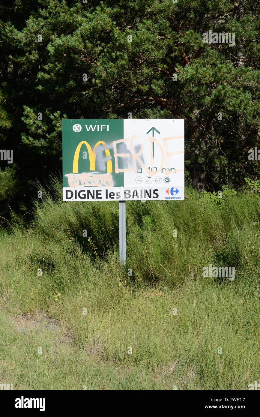 Defaced or Vandalised McDonalds Sign near Digne-les-Bains France Stock Photo