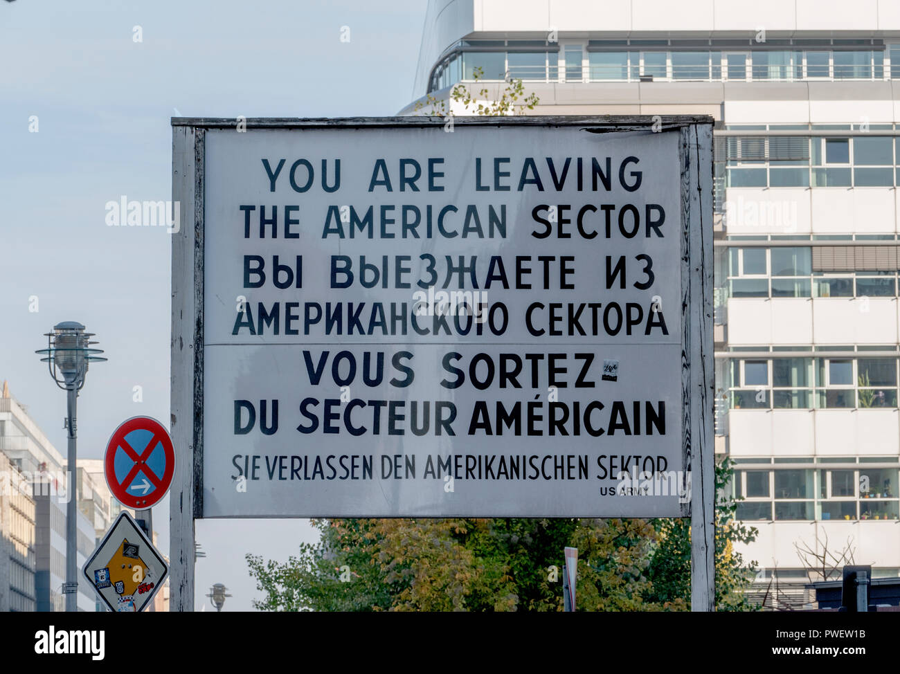 An American signpost at Checkpoint Charlie, Berlin, Germany. A remnant from the Berlin Wall which separated East and West Germany in Berlin. Stock Photo
