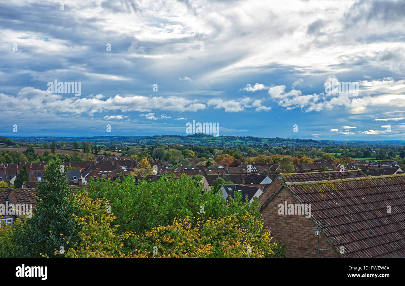 A view of the Somerset Levels And the Glastonbury Tor on a clear and cloudy day in Wells, Somerset, UK Stock Photo