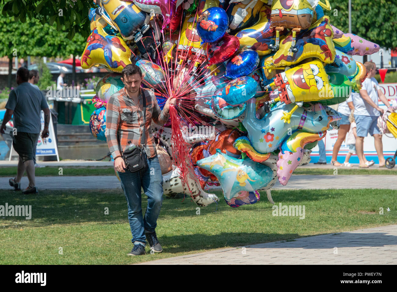 Stratford upon Avon Warwickshire England UK May 20th 2018 balloon seller looking unhappy as the
