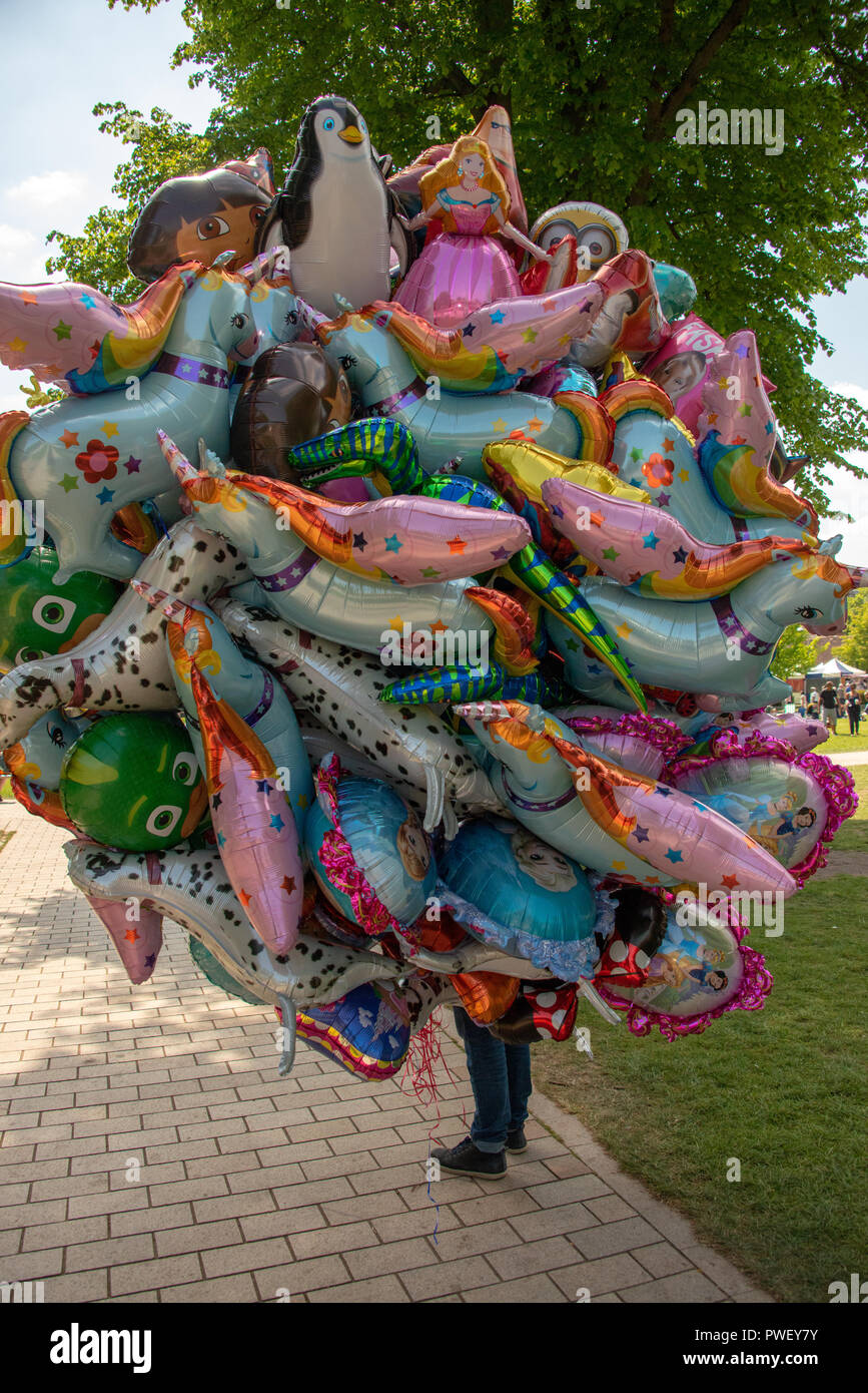 Stratford upon Avon Warwickshire England UK May 20th 2018 balloon seller looking unhappy as the
