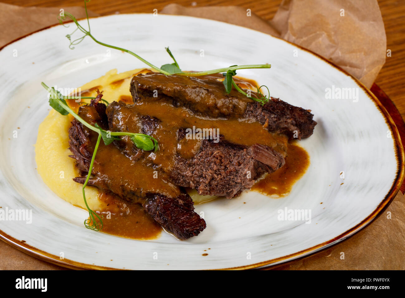 Roasted beef with gravy and mashed potato Stock Photo Alamy
