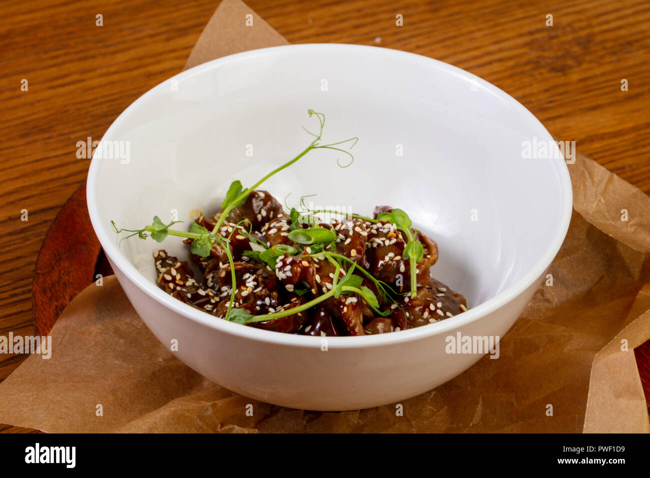 Roasted chicken giblets served sesam seeds Stock Photo Alamy