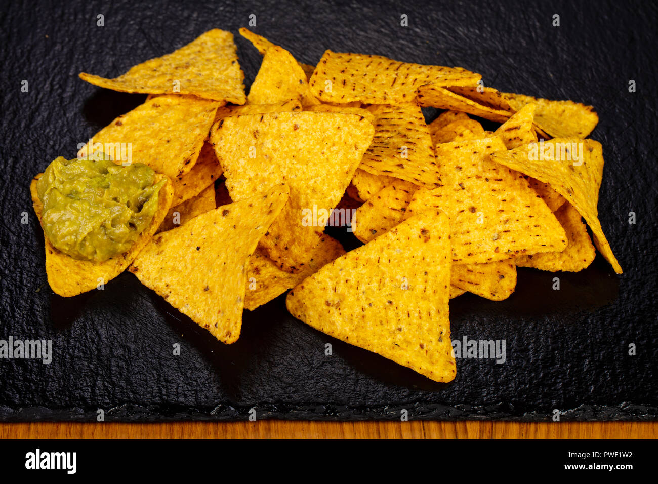 Mexican chips Nachos with avocado sauce Stock Photo Alamy