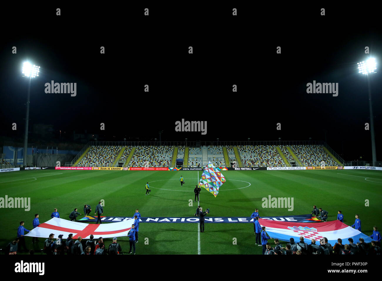 A general view of the pitch as England and Croatia flags are held up during the UEFA Nations League match at Stadion HNK Rijeka in Croatia. Stock Photo