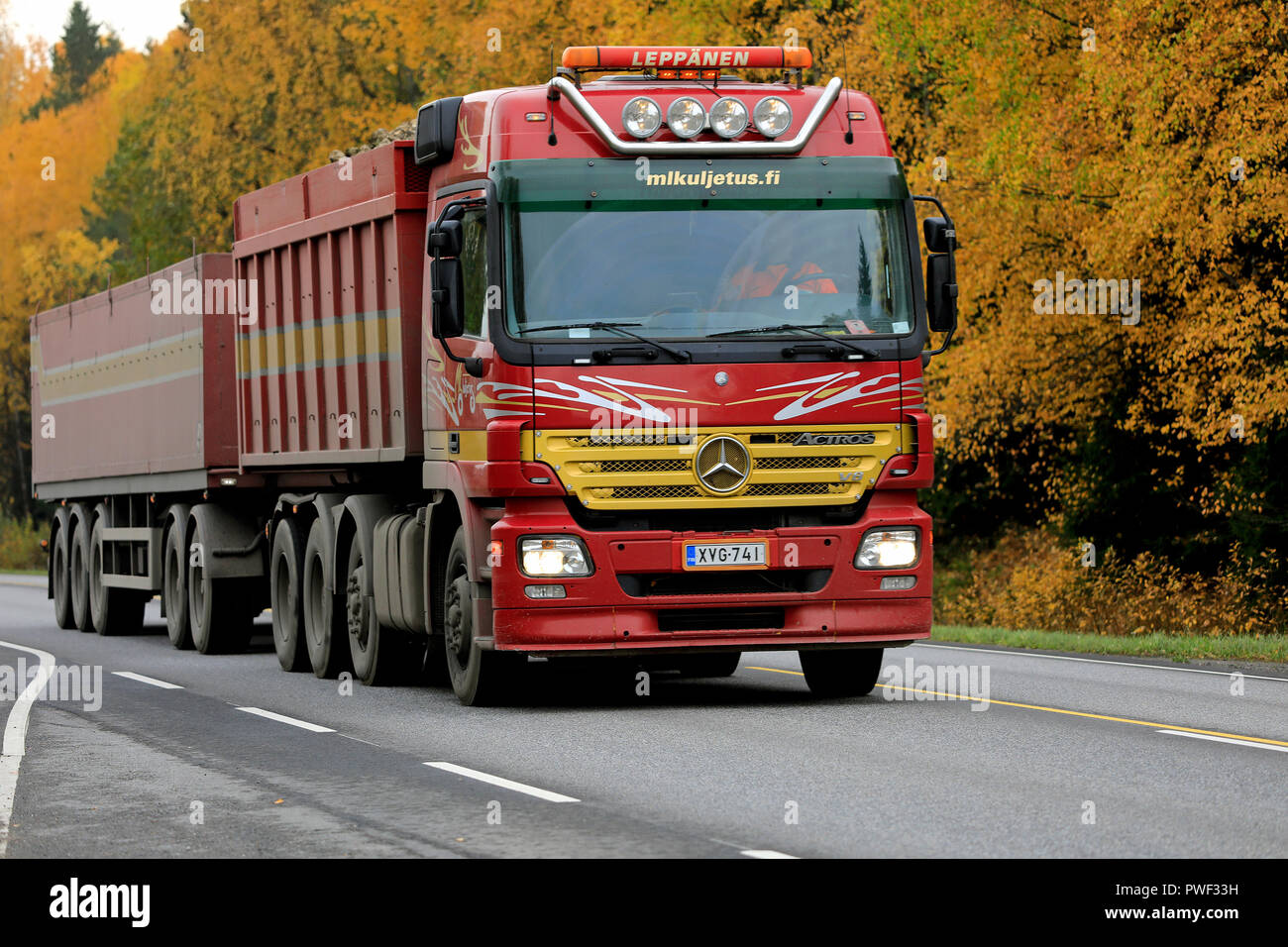 Salo, Finland - October 13, 2018: Red Mercedes-Benz Actros truck of ML Kuljetus Ky in seasonal sugar beet haul on autumnal highway in South of Finland Stock Photo