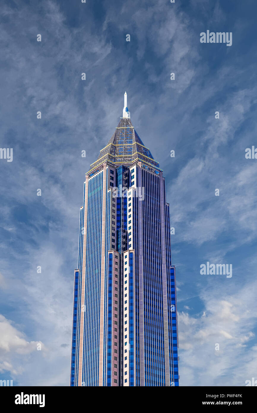 A modern skyscraper under clear blue skies Stock Photo - Alamy