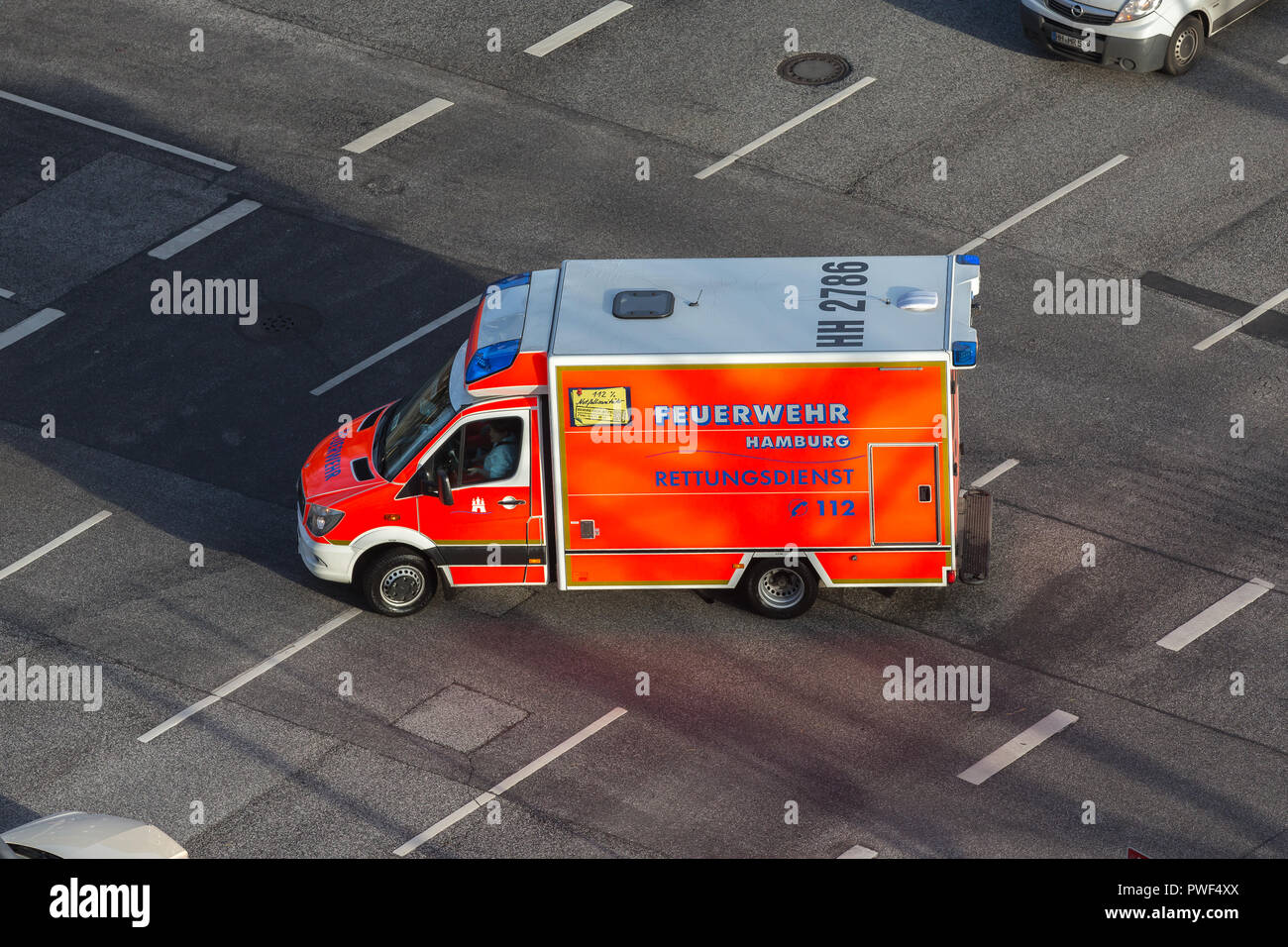 ambulance vehicle on a junction in Hamburg Stock Photo