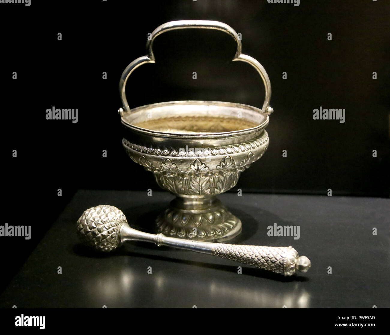 Holy water bucket (wessel) and aspersorium. 17th-18th centuries. Spun, cast an chased silver. Goa, in times as a colony of Portugal,India. Stock Photo