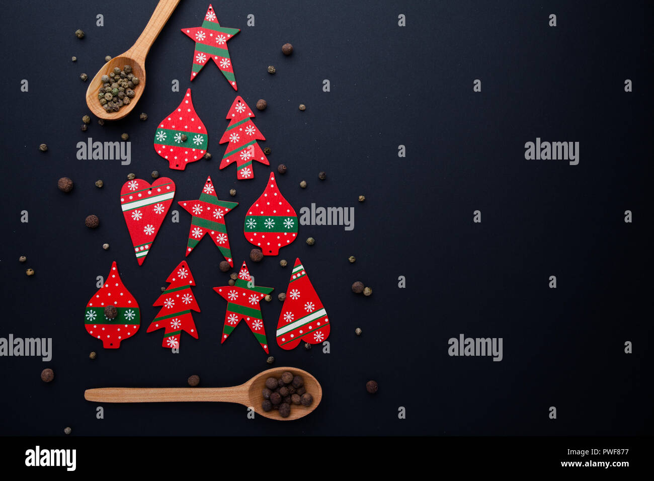 Christmas tree made from red candies and wooden spoons Stock Photo