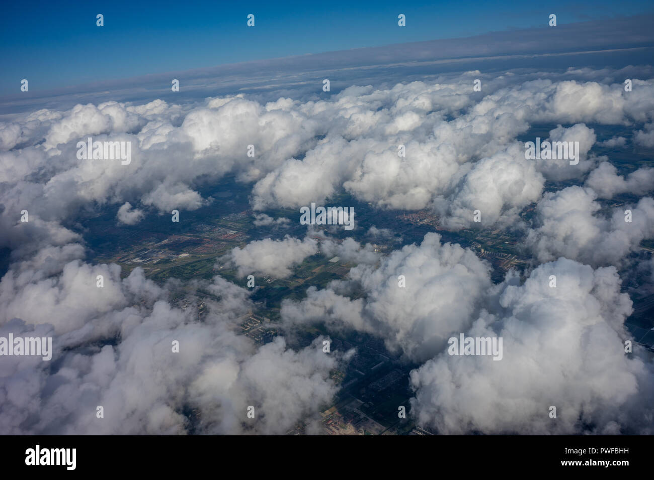 Farm, land in Holland, Netherlands with canal viewed from plane in sky