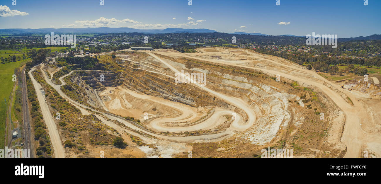 Closed limestone mine and mountains in Melbourne, Australia - wide aerial panorama Stock Photo