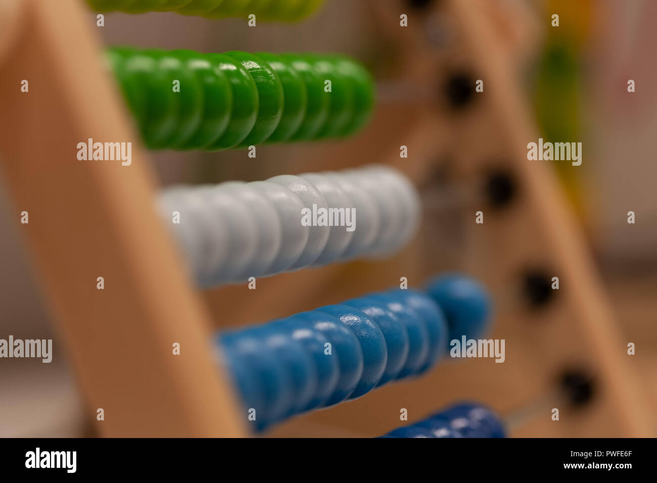 Traditional wooden abacus for kids. Shallow focus. Stock Photo