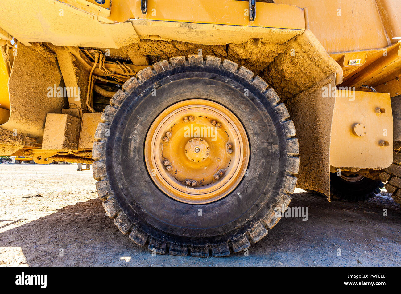 Large wheel of industrial heavy machinery - closeup Stock Photo