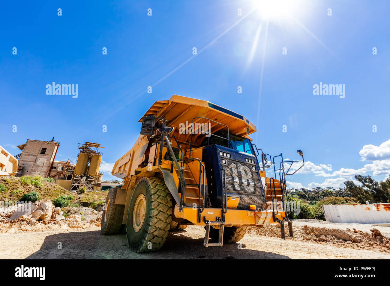 Yellow dump truck on a construction site Stock Photo