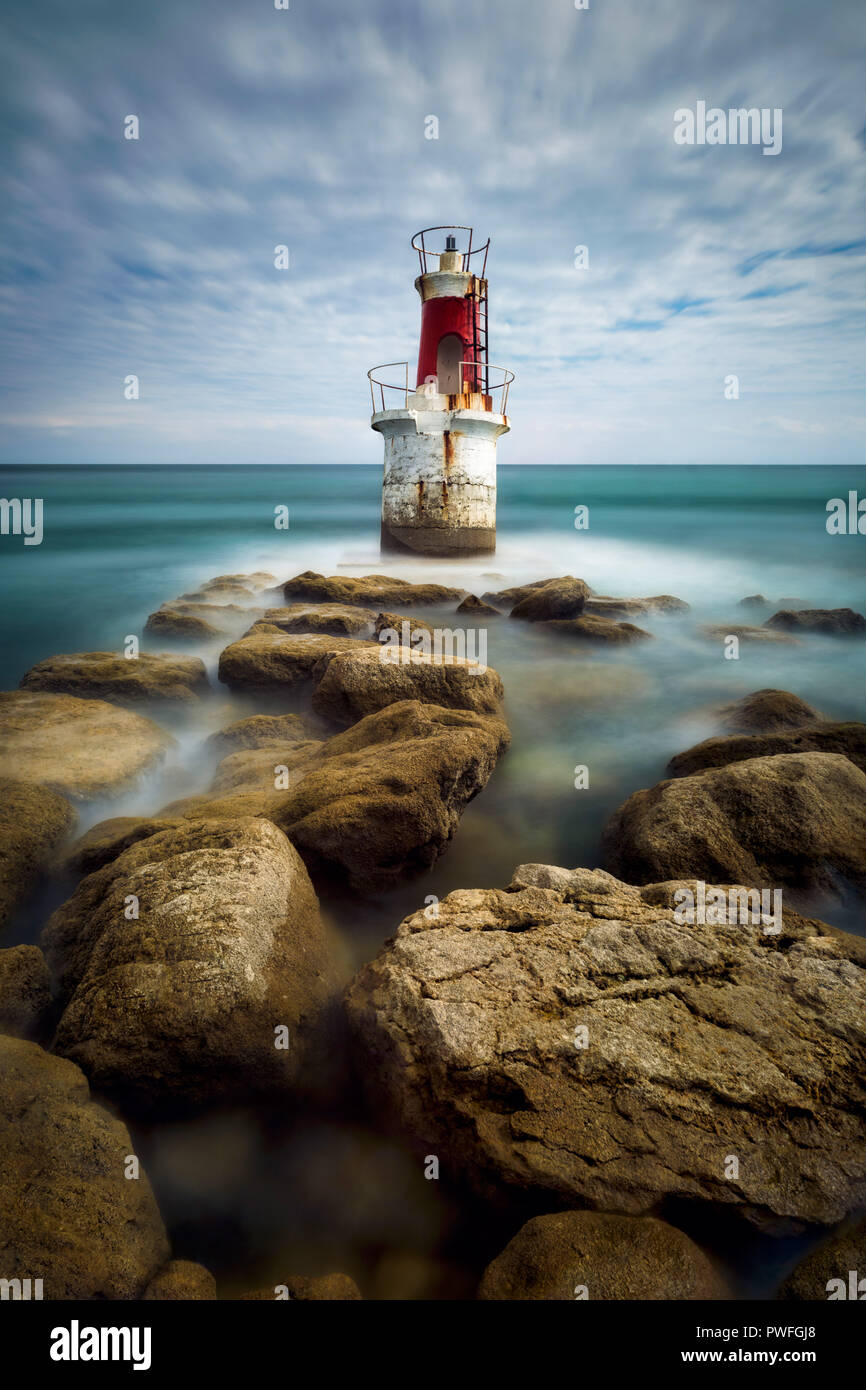 Old lighthouse in San Vicente de la Barquera (Cantabria - Spain) Stock Photo