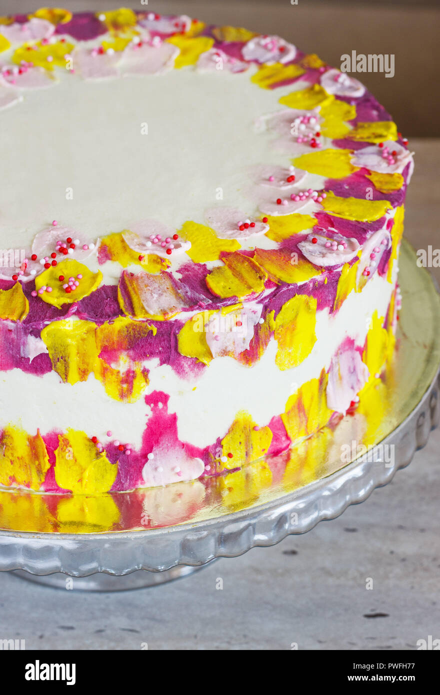 Charlotte Eclair Birthday Cake Garnished With Fresh Flowers, Waffle  Butterflies And Gold Topper, Tied With A White Ribbon, On White Background.  Stock Photo, Picture and Royalty Free Image. Image 174667061.