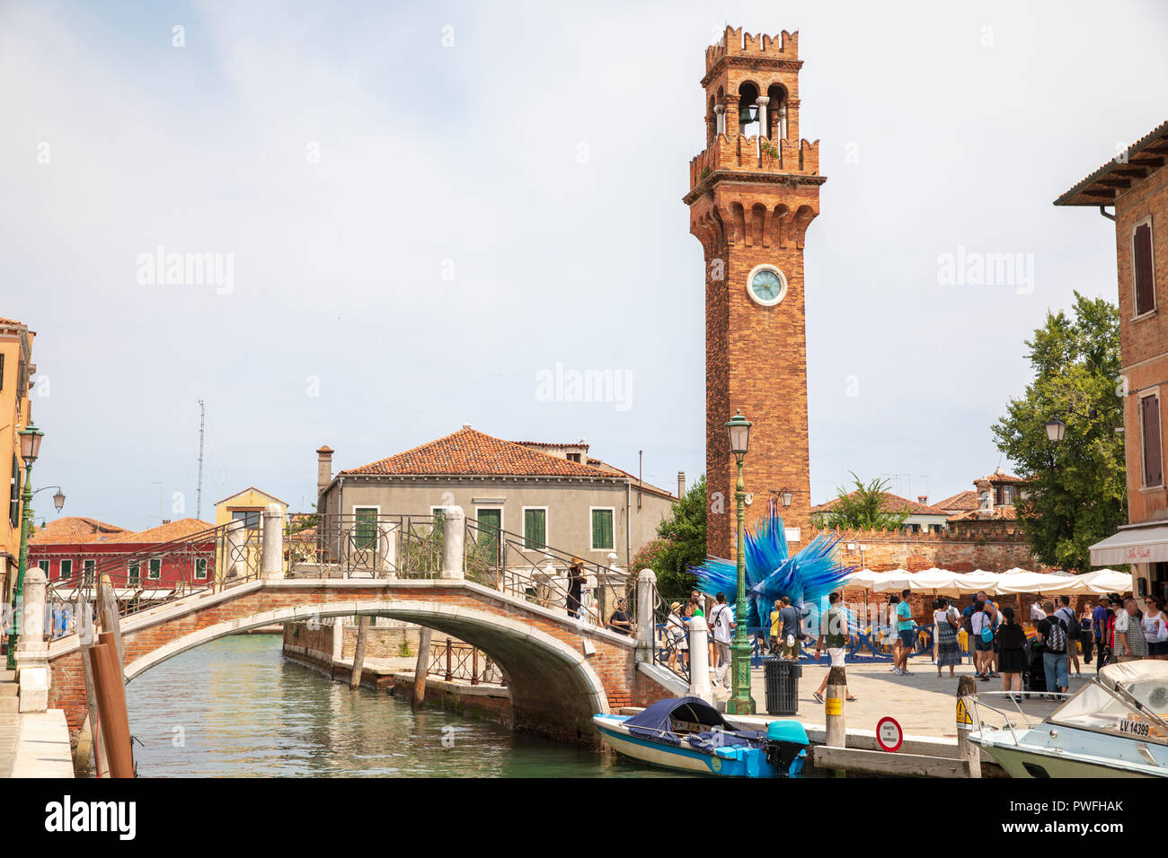 Ponte San Pietro Martire (bridge) & Torre dell'Orologio (tower) on Murano Island, Venice, Italy. Stock Photo