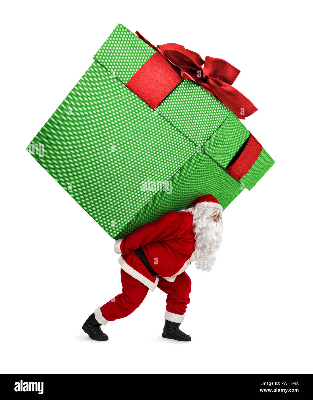 Santa Claus carrying huge christmas gift isolated on white background Stock Photo