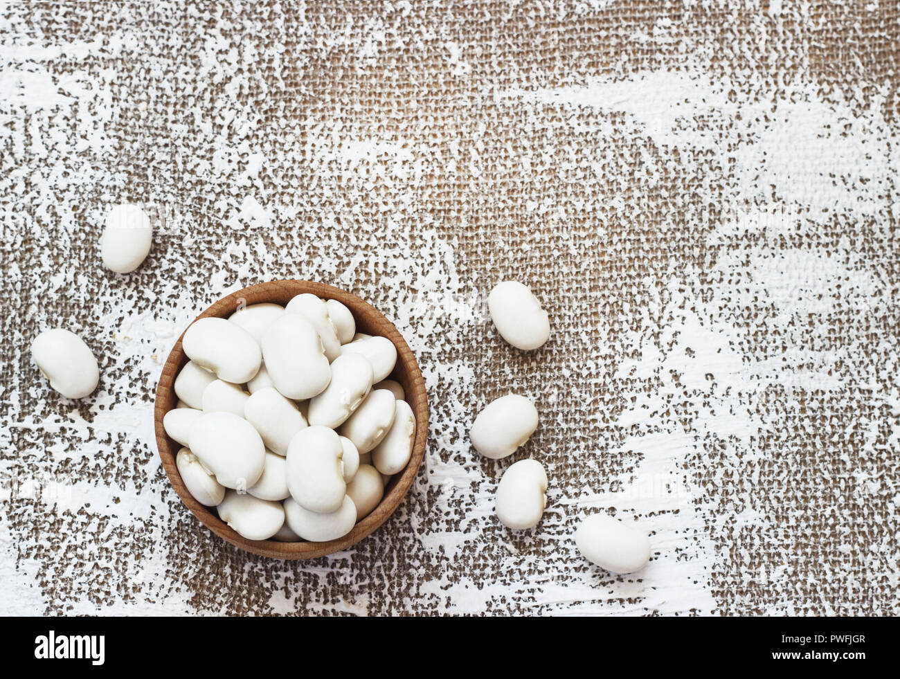 White navy beans in wooden bowl, also haricot, pearl haricot, boston