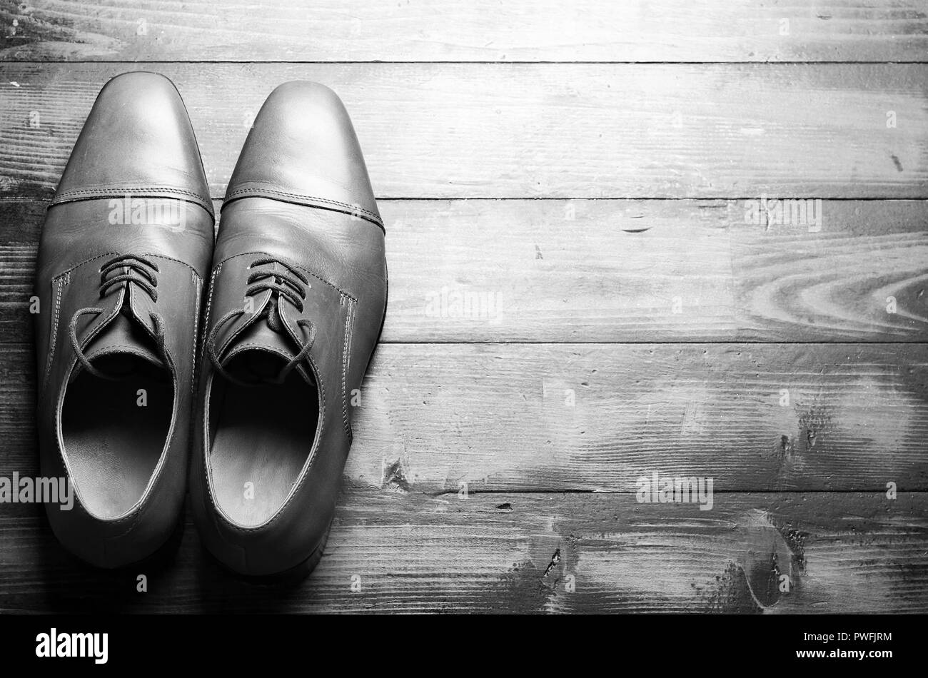 Men's leather shoes on a wooden floor Stock Photo