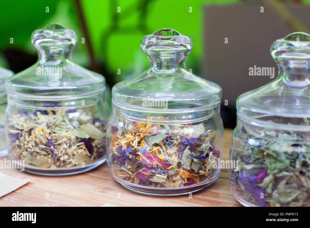 https://c8.alamy.com/comp/PWFK13/different-flavor-flower-tea-in-glass-jars-dried-flowers-organic-herbal-tea-organic-tea-PWFK13.jpg