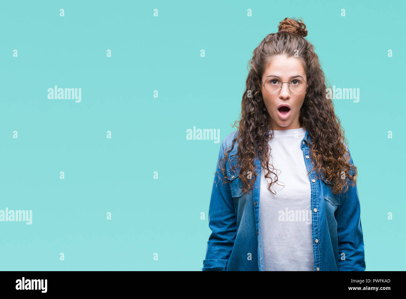 Beautiful Young Brunette Curly Hair Girl Wearing Glasses Over