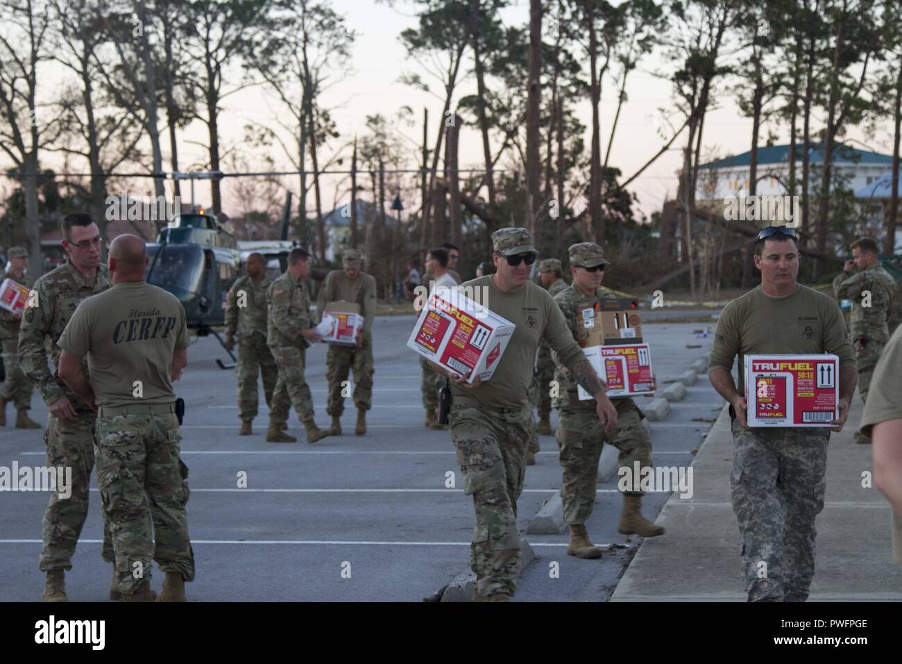 Members of the Florida National Guard's CERF-P (Chemical, Biological, Radiological, Nuclear and high-yield Explosive (CBRNE) Enhanced Response Force Package) unit offload supplies that need to be replenished as they continue their hurricane relief efforts in Florida's panhandle, Oct. 13, 2018, October 14, 2018. Hurricane Michael decimated the panhandle as it made landfall, which left hundreds of thousands people without power, food or water. () Stock Photo