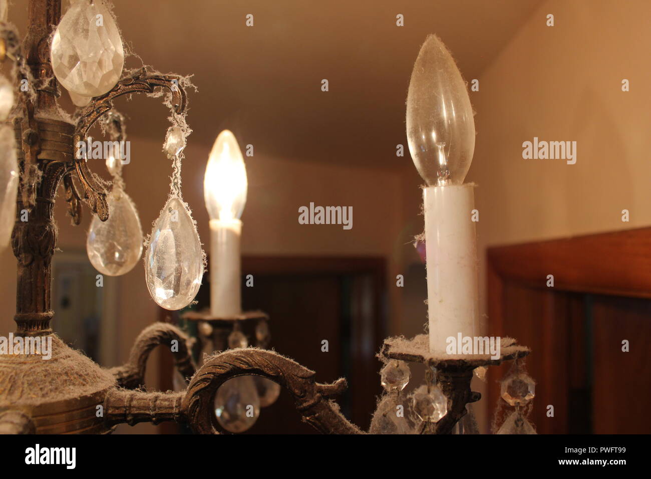 Dusty and vintage chandelier candelabra. Stock Photo