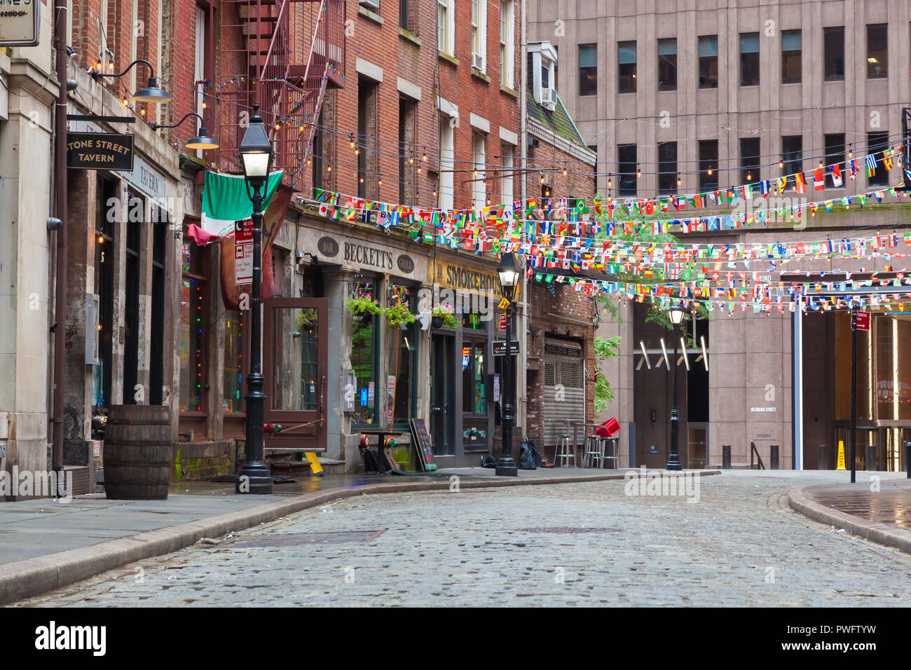NEW YORK, NEW YORK - August 19, 2018: A view of an empty Stone Street in Lower Manhattan, with it's many restaurants and pubs Stock Photo