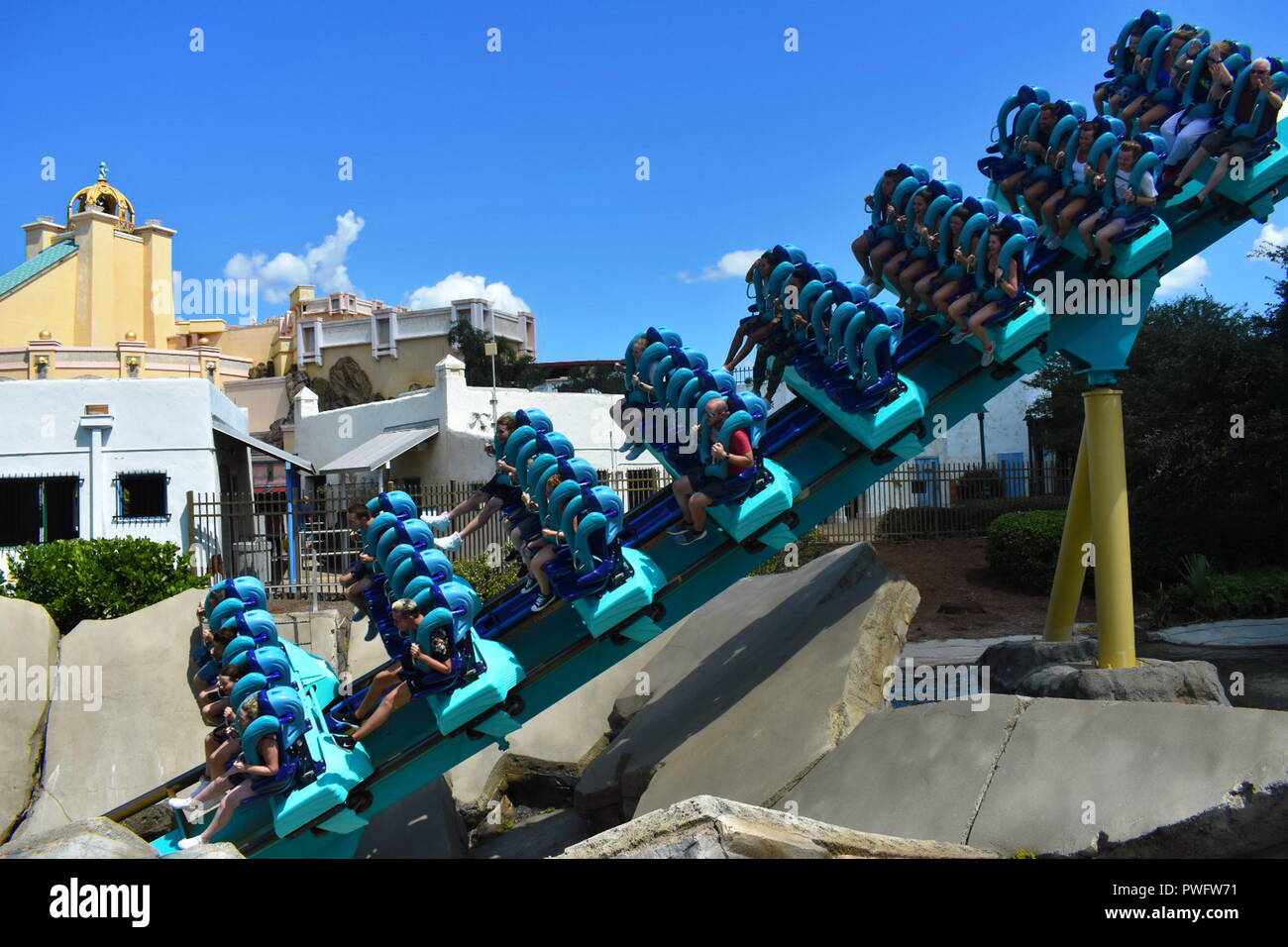 Orlando, Florida. September 21, 2018. People ride Kraken Roller Coaster at Seaworld Theme Park. Several are screaming. Stock Photo